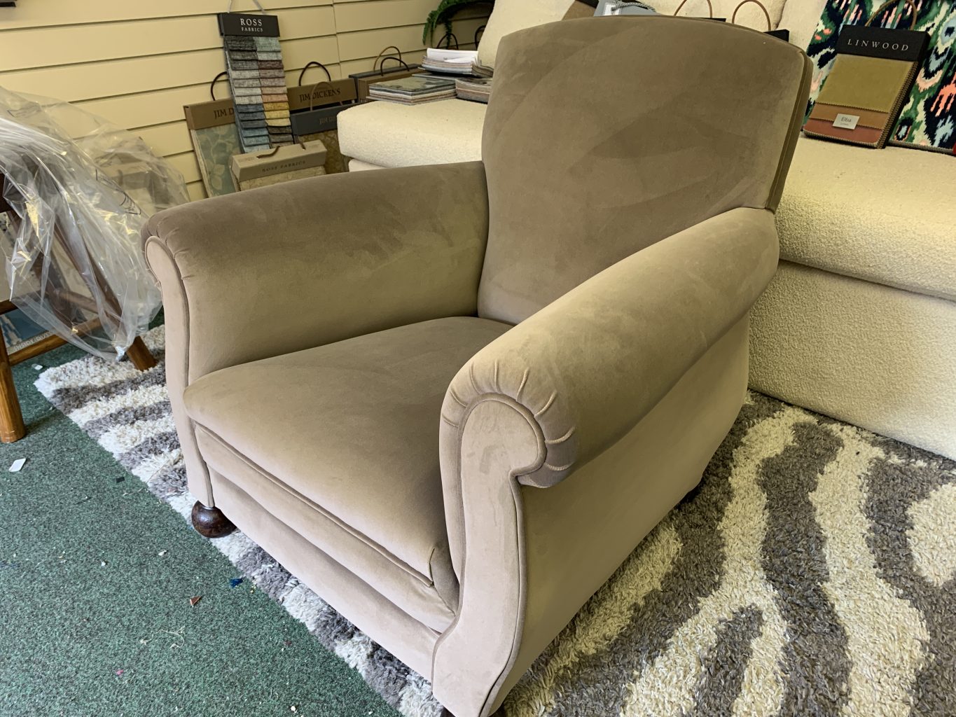 Reupholstered occasional chair.