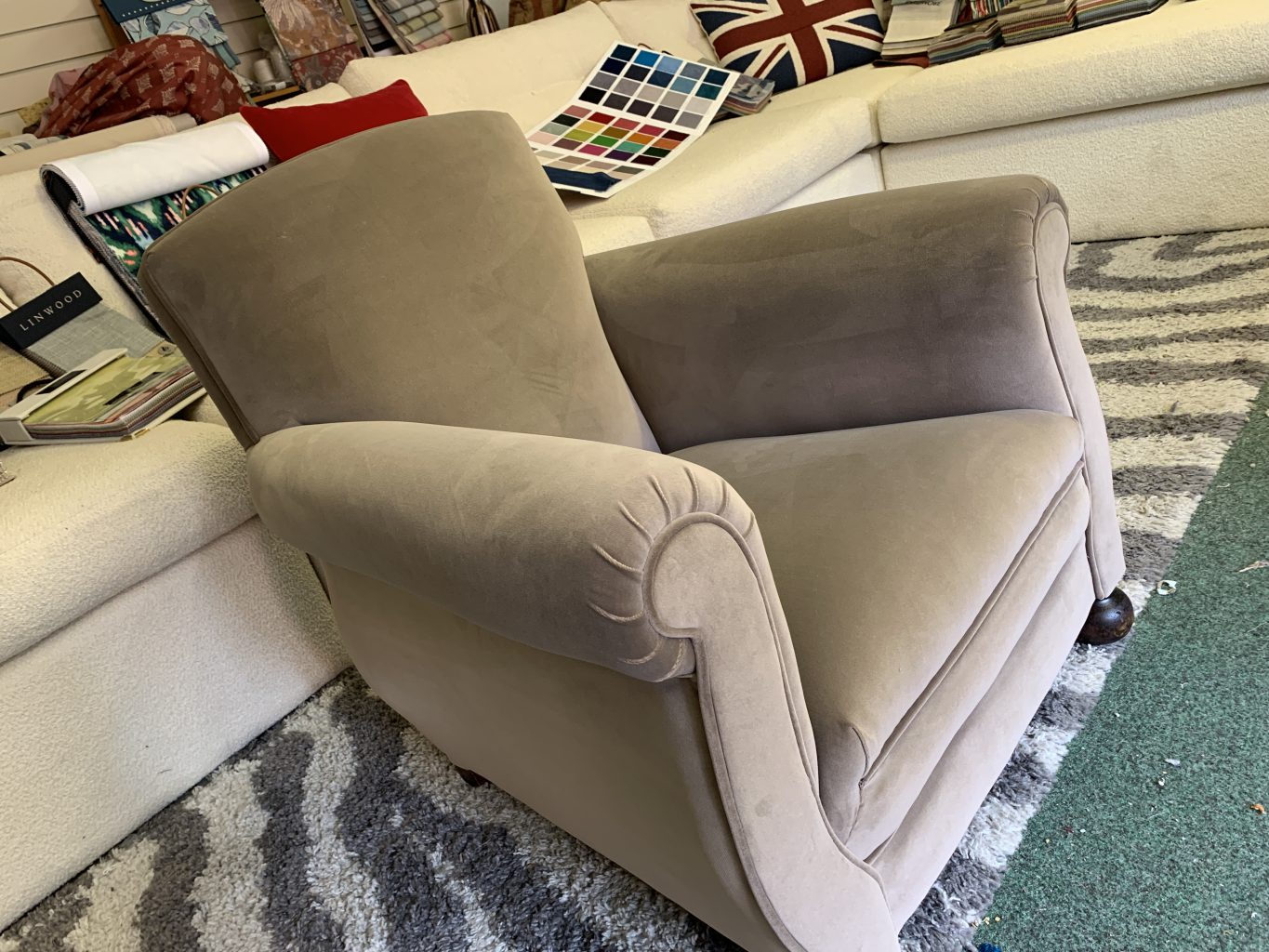 Reupholstered occasional chair.